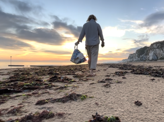 Image shows Artist Ryan Board beside installation from his MUYBRIDGE water pollution project in Margate